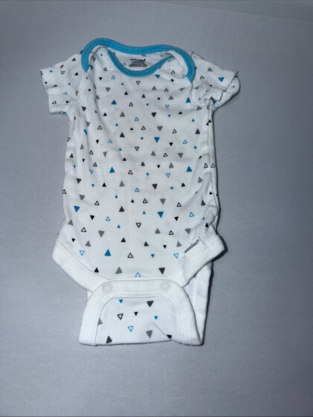 White Baby Onesie with Blue and Gray Triangle Print